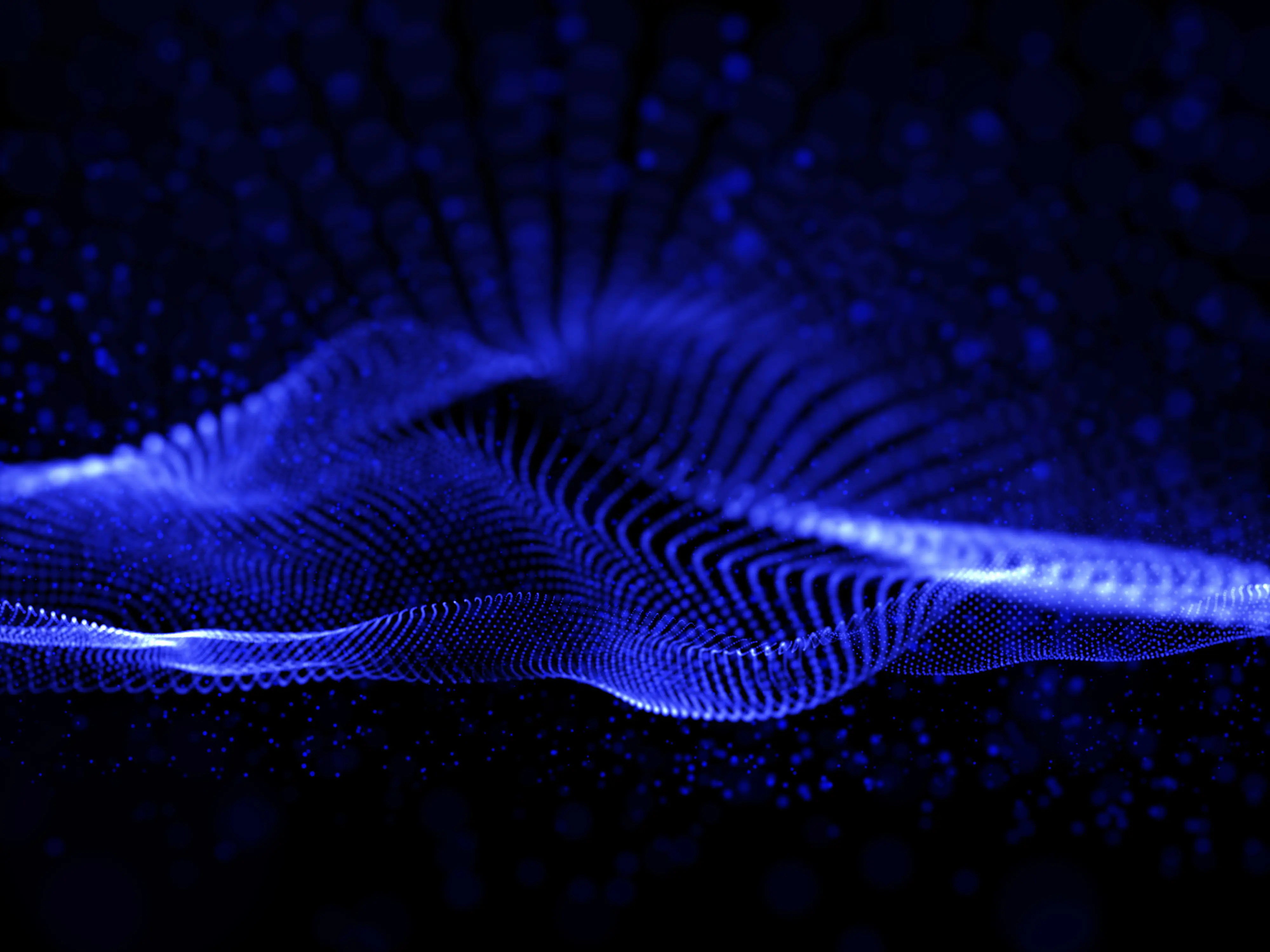 Blue particle wave animation on dark background—ideal for AI, data science, quantum computing, or futuristic tech visuals.