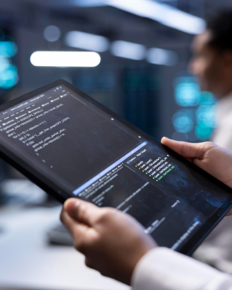 Developer coding on tablet. Mobile software development and programming technology.