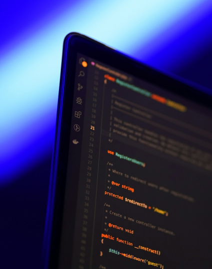 Laptop displaying programming code. Software development and web coding technology.
