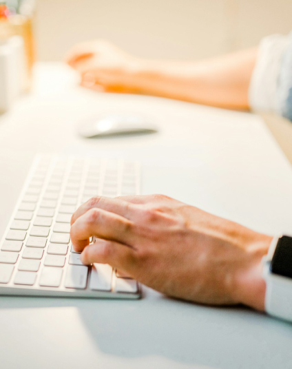 Hands typing on keyboard. Professional office work, data entry, computer programming.